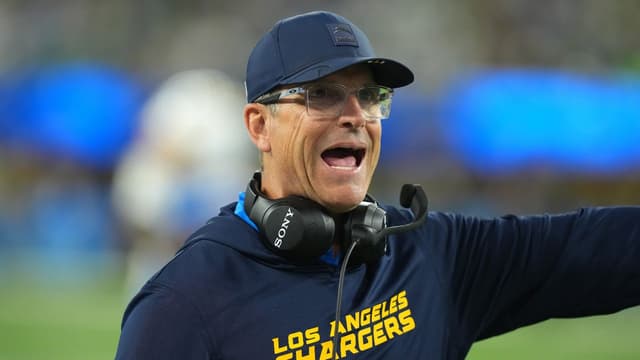 Jim Harbaugh says “thrill of victory” vs Eagles ranks with birth of his children