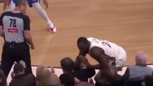 Draymond Green Slams Into Courtside Fan While Trying to Save the Ball