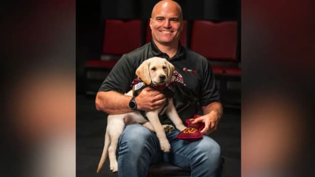Washington Commanders Introduce Future Service Dog TJ To Team