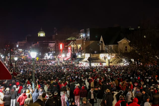 Hoosier Fans Go Wild After Natty Win With Street Parties, Pole Climbing, and Fires