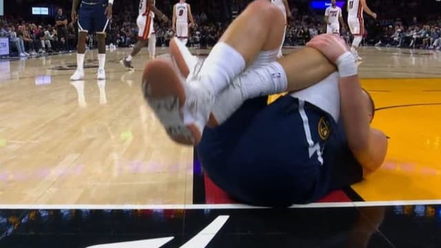 Nikola Jokic Goes Down Hard Holding His Knee